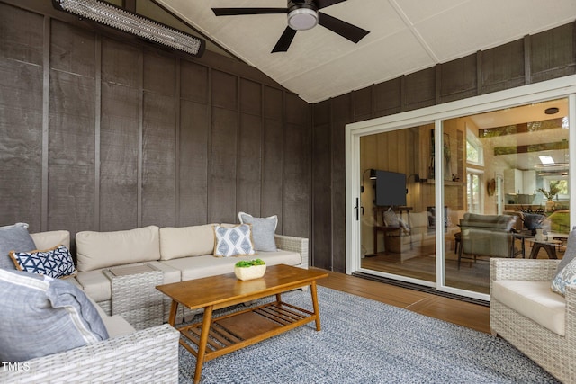 3033 Sylvania Dr, Raleigh, NC 27607 - living room with wood finished floors, a ceiling fan, and vaulted ceiling