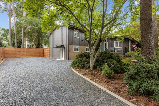 3033 Sylvania Dr, Raleigh, NC 27607 - view of front of house featuring brick siding and board and batten siding