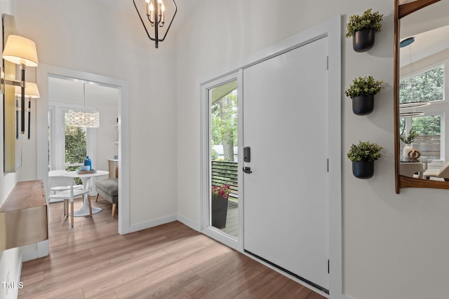 3033 Sylvania Dr, Raleigh, NC 27607 - entryway featuring a chandelier and light wood-style floors