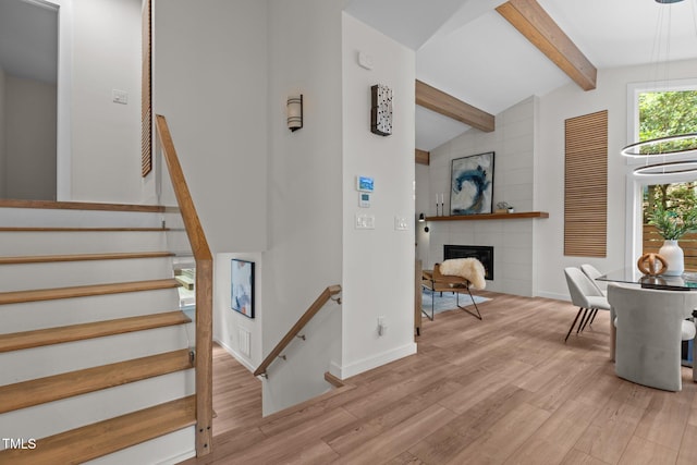 3033 Sylvania Dr, Raleigh, NC 27607 - stairs with wood finished floors and a fireplace
