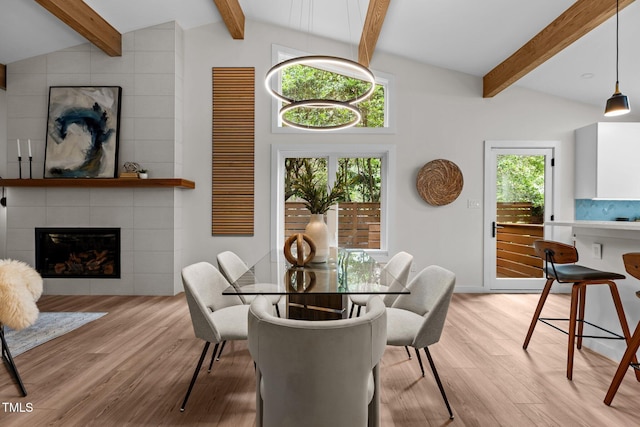 3033 Sylvania Dr, Raleigh, NC 27607 - dining area featuring light wood finished floors and a fireplace