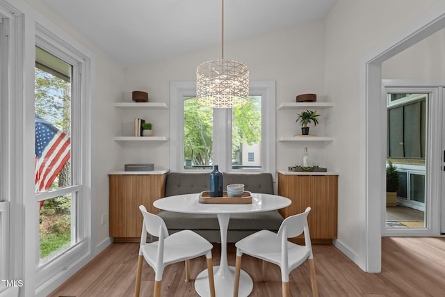 3033 Sylvania Dr, Raleigh, NC 27607 - dining room with light wood-style flooring, vaulted ceiling, and healthy amount of natural light