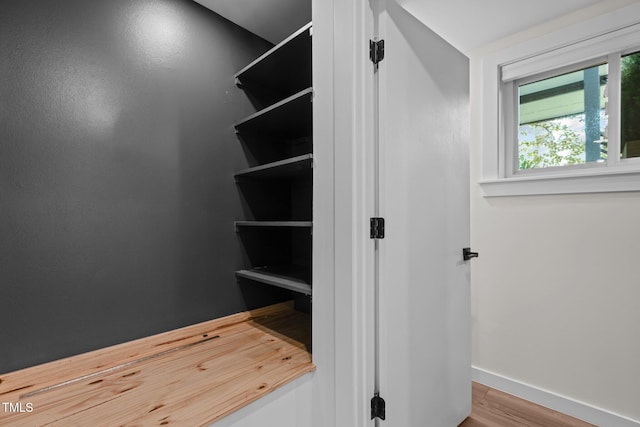 3033 Sylvania Dr, Raleigh, NC 27607 - walk in closet with wood finished floors