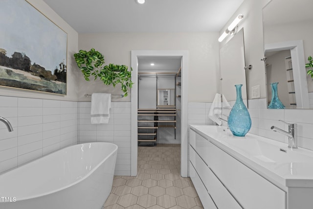 3033 Sylvania Dr, Raleigh, NC 27607 - full bath featuring tile walls, a freestanding tub, vanity, tile patterned floors, and wainscoting