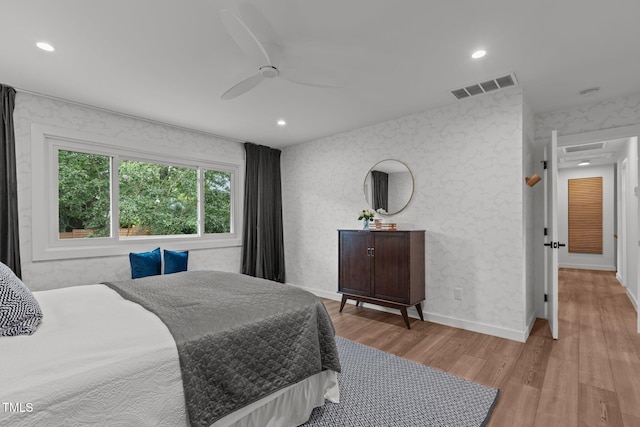 3033 Sylvania Dr, Raleigh, NC 27607 - bedroom with wood finished floors, recessed lighting, and a ceiling fan