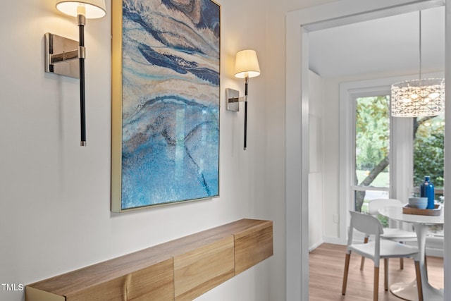 3033 Sylvania Dr, Raleigh, NC 27607 - dining space featuring light wood finished floors and a chandelier