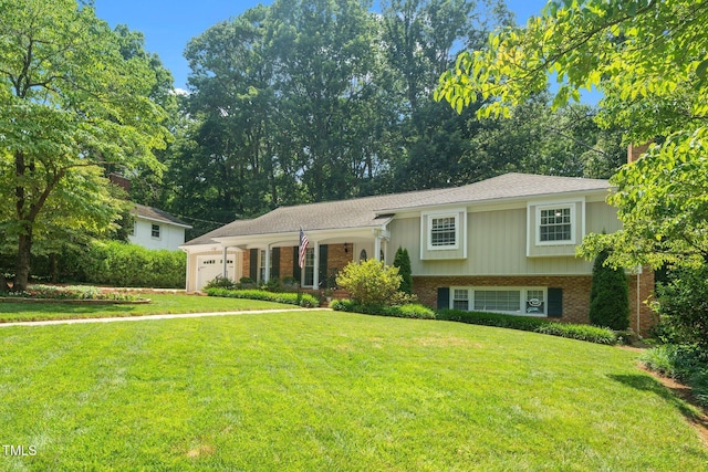1312 Hampton Valley Rd, Cary, NC 27511 - view of front of house featuring a garage, a front lawn, and brick siding