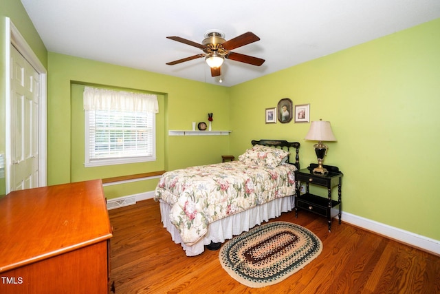 1312 Hampton Valley Rd, Cary, NC 27511 - bedroom with wood finished floors and a ceiling fan