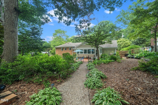 1312 Hampton Valley Rd, Cary, NC 27511 - back of house featuring brick siding and a patio