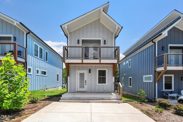 2904 Wadsworth Ave # A, Durham, NC 27707 - view of front facade with a balcony, board and batten siding, and a porch