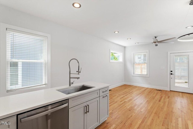 2904 Wadsworth Ave # A, Durham, NC 27707 - kitchen with dishwasher, light countertops, ceiling fan, light wood finished floors, and recessed lighting