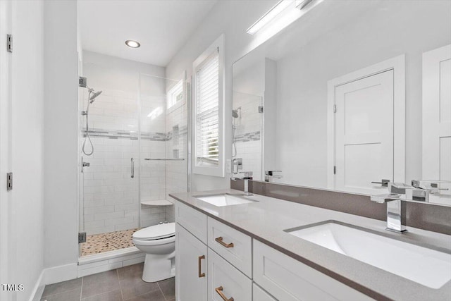 2904 Wadsworth Ave # A, Durham, NC 27707 - bathroom featuring a shower stall, double vanity, tile patterned flooring, and recessed lighting