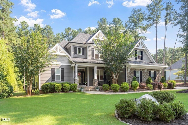 1203 Smith Creek Way, Wake Forest, NC 27587 - craftsman house with covered porch, a front yard, and stone siding