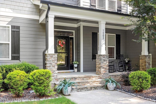 1203 Smith Creek Way, Wake Forest, NC 27587 - doorway to property featuring a porch