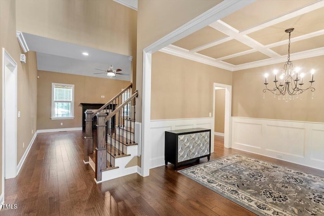 1203 Smith Creek Way, Wake Forest, NC 27587 - foyer entrance featuring coffered ceiling, stairs, wood finished floors, a wainscoted wall, and a chandelier