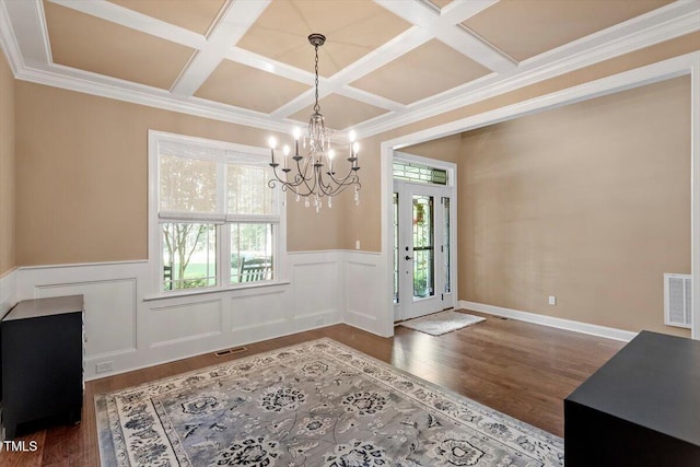 1203 Smith Creek Way, Wake Forest, NC 27587 - dining space featuring coffered ceiling, a chandelier, a wainscoted wall, wood finished floors, and beamed ceiling