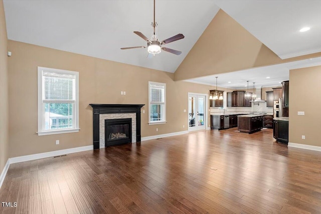 1203 Smith Creek Way, Wake Forest, NC 27587 - unfurnished living room with a fireplace, ceiling fan, dark wood-type flooring, high vaulted ceiling, and recessed lighting