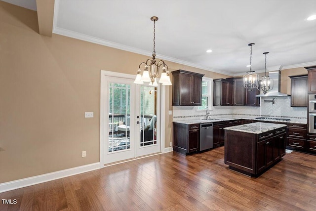 1203 Smith Creek Way, Wake Forest, NC 27587 - kitchen with a chandelier, appliances with stainless steel finishes, wall chimney exhaust hood, dark brown cabinets, and tasteful backsplash