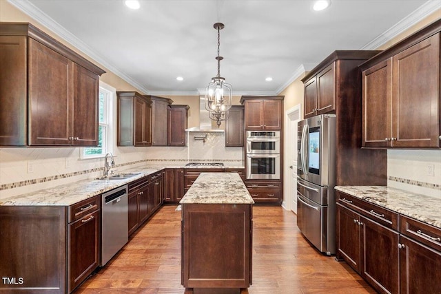 1203 Smith Creek Way, Wake Forest, NC 27587 - kitchen with appliances with stainless steel finishes, wall chimney range hood, a center island, backsplash, and recessed lighting