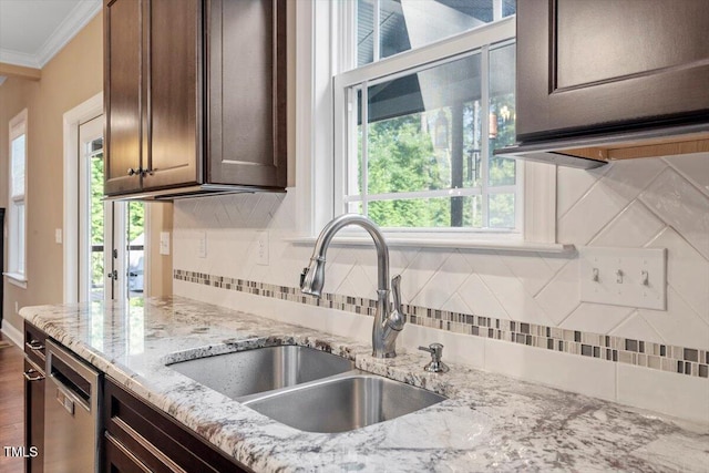 1203 Smith Creek Way, Wake Forest, NC 27587 - kitchen with crown molding, plenty of natural light, tasteful backsplash, and dark brown cabinets
