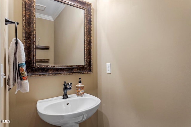 1203 Smith Creek Way, Wake Forest, NC 27587 - bathroom featuring crown molding and a sink