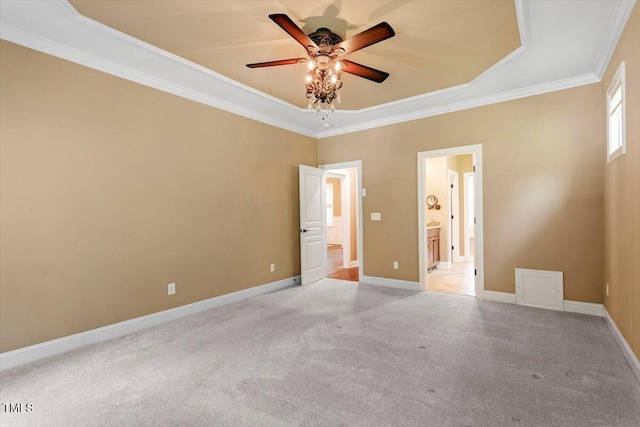 1203 Smith Creek Way, Wake Forest, NC 27587 - unfurnished bedroom with light carpet, ornamental molding, connected bathroom, a tray ceiling, and ceiling fan