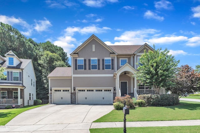 2700 Banks Lake Ct, Fuquay Varina, NC 27526 - craftsman inspired home featuring a front lawn, driveway, a garage, a porch, and stone siding