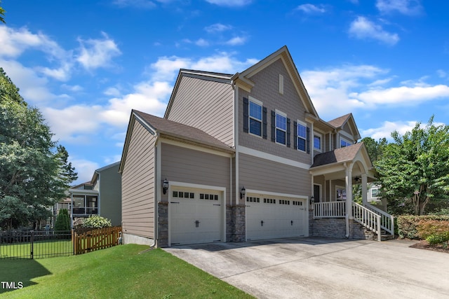 2700 Banks Lake Ct, Fuquay Varina, NC 27526 - view of home's exterior featuring an attached garage, driveway, and stone siding