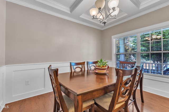 2700 Banks Lake Ct, Fuquay Varina, NC 27526 - dining space featuring a chandelier, healthy amount of natural light, ornamental molding, light wood-style flooring, and wainscoting