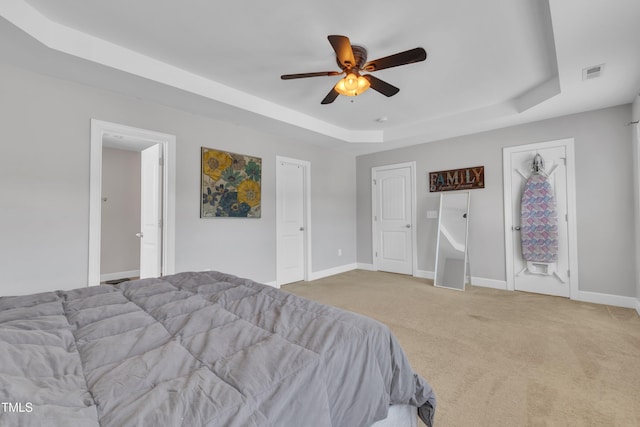 2700 Banks Lake Ct, Fuquay Varina, NC 27526 - carpeted bedroom with a raised ceiling and a ceiling fan