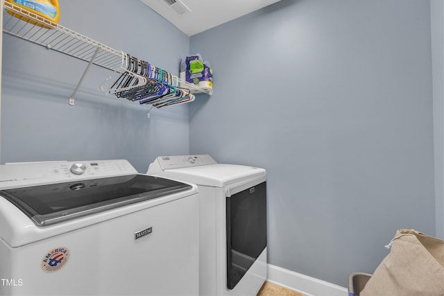 2700 Banks Lake Ct, Fuquay Varina, NC 27526 - laundry area featuring washer and dryer and baseboards
