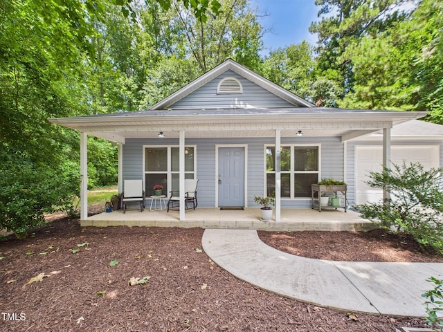 422 Revere Rd, Hillsborough, NC 27278 - view of front facade with a porch and a garage