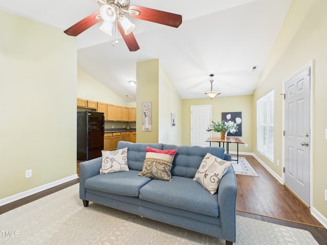 422 Revere Rd, Hillsborough, NC 27278 - living room with light wood-style flooring, lofted ceiling, and a ceiling fan