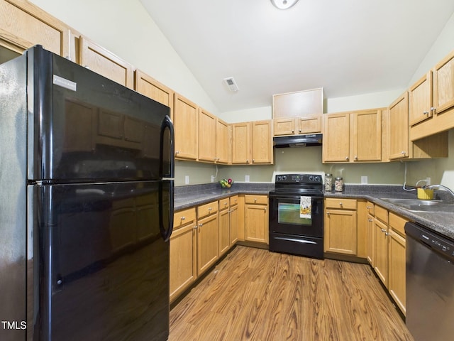 422 Revere Rd, Hillsborough, NC 27278 - kitchen featuring black appliances, under cabinet range hood, vaulted ceiling, wood finished floors, and dark countertops
