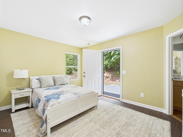 422 Revere Rd, Hillsborough, NC 27278 - bedroom with access to outside and wood finished floors