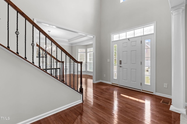 316 Hilliard Forest Dr, Cary, NC 27519 - entrance foyer with decorative columns, hardwood / wood-style floors, and stairway