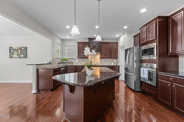 316 Hilliard Forest Dr, Cary, NC 27519 - kitchen featuring stainless steel appliances, dark wood-style flooring, backsplash, and recessed lighting