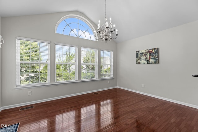 316 Hilliard Forest Dr, Cary, NC 27519 - unfurnished room with a chandelier, vaulted ceiling, and hardwood / wood-style floors