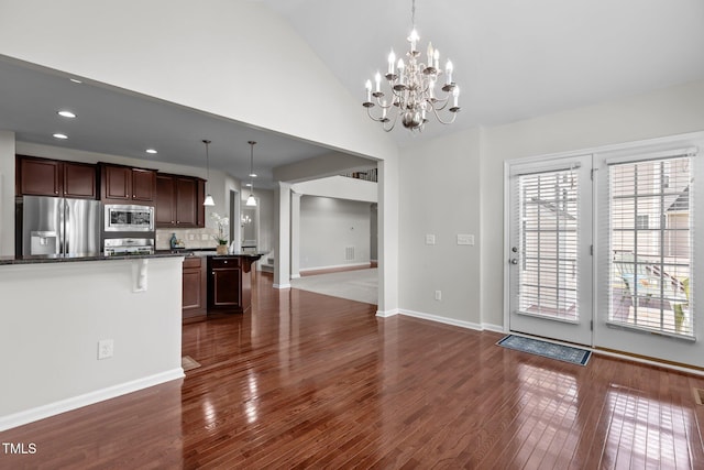 316 Hilliard Forest Dr, Cary, NC 27519 - kitchen with stainless steel appliances, a chandelier, dark wood finished floors, hanging light fixtures, and recessed lighting