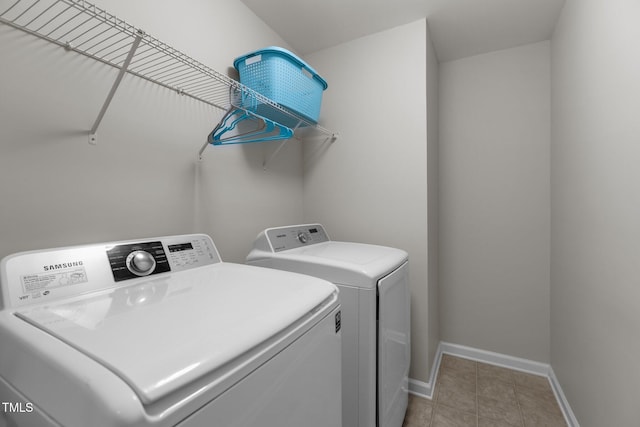316 Hilliard Forest Dr, Cary, NC 27519 - laundry room with washing machine and dryer and light tile patterned floors