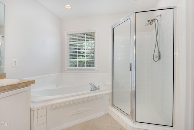 317 Yellow Poplar Ave, Wake Forest, NC 27587 - full bathroom featuring a bath, a shower stall, vanity, tile patterned flooring, and recessed lighting