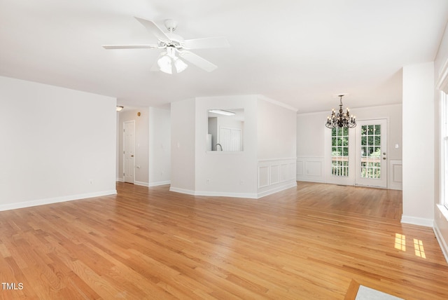 317 Yellow Poplar Ave, Wake Forest, NC 27587 - unfurnished living room with a chandelier, light wood finished floors, and a ceiling fan