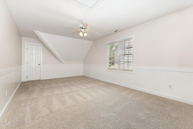 317 Yellow Poplar Ave, Wake Forest, NC 27587 - additional living space with a wainscoted wall, ceiling fan, light carpet, and lofted ceiling