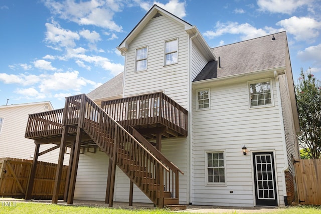 317 Yellow Poplar Ave, Wake Forest, NC 27587 - rear view of property featuring a deck, roof with shingles, and stairs