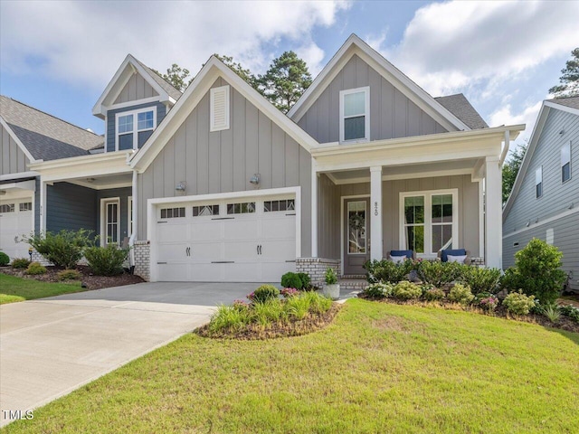 820 Whistable Ave, Wake Forest, NC 27587 - craftsman-style house featuring board and batten siding, a porch, a front yard, a garage, and concrete driveway
