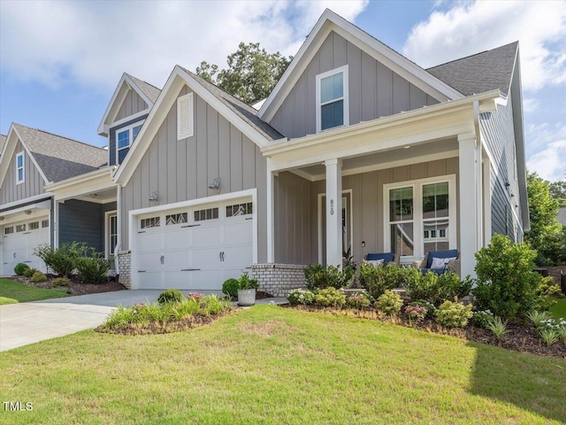 820 Whistable Ave, Wake Forest, NC 27587 - craftsman house with board and batten siding, covered porch, a front lawn, and driveway