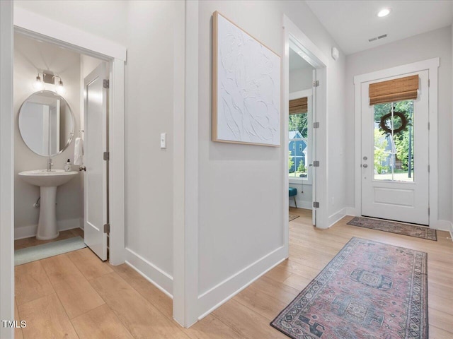820 Whistable Ave, Wake Forest, NC 27587 - entryway with light wood-style flooring and baseboards