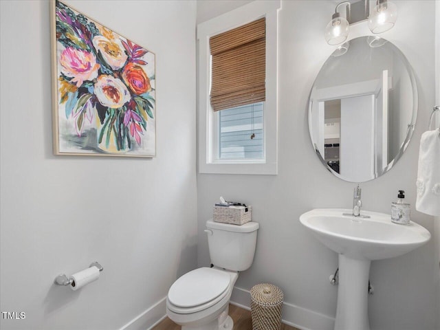 820 Whistable Ave, Wake Forest, NC 27587 - bathroom with toilet and wood finished floors