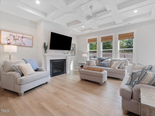 820 Whistable Ave, Wake Forest, NC 27587 - living area with coffered ceiling, light wood-style flooring, ceiling fan, a glass covered fireplace, and recessed lighting