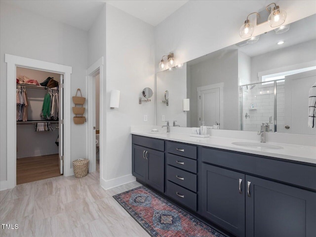 820 Whistable Ave, Wake Forest, NC 27587 - bathroom featuring double vanity, a stall shower, and a spacious closet